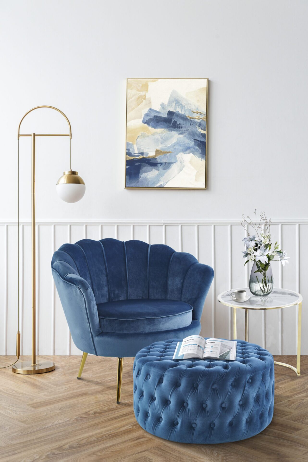 Picture frame with abstract art by a pink velvet armchair