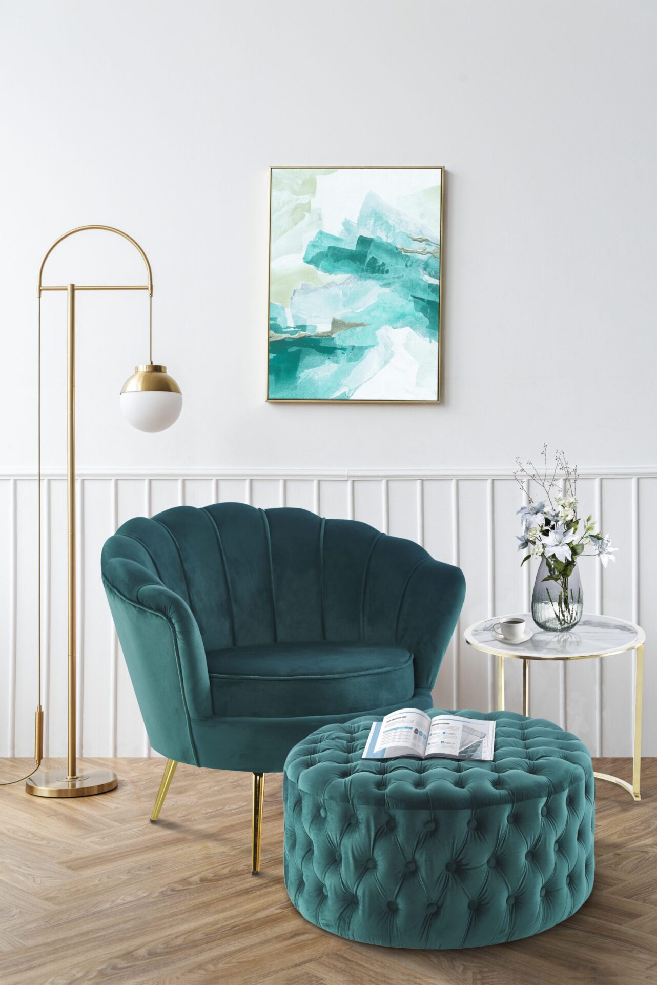 Picture frame with abstract art by a pink velvet armchair