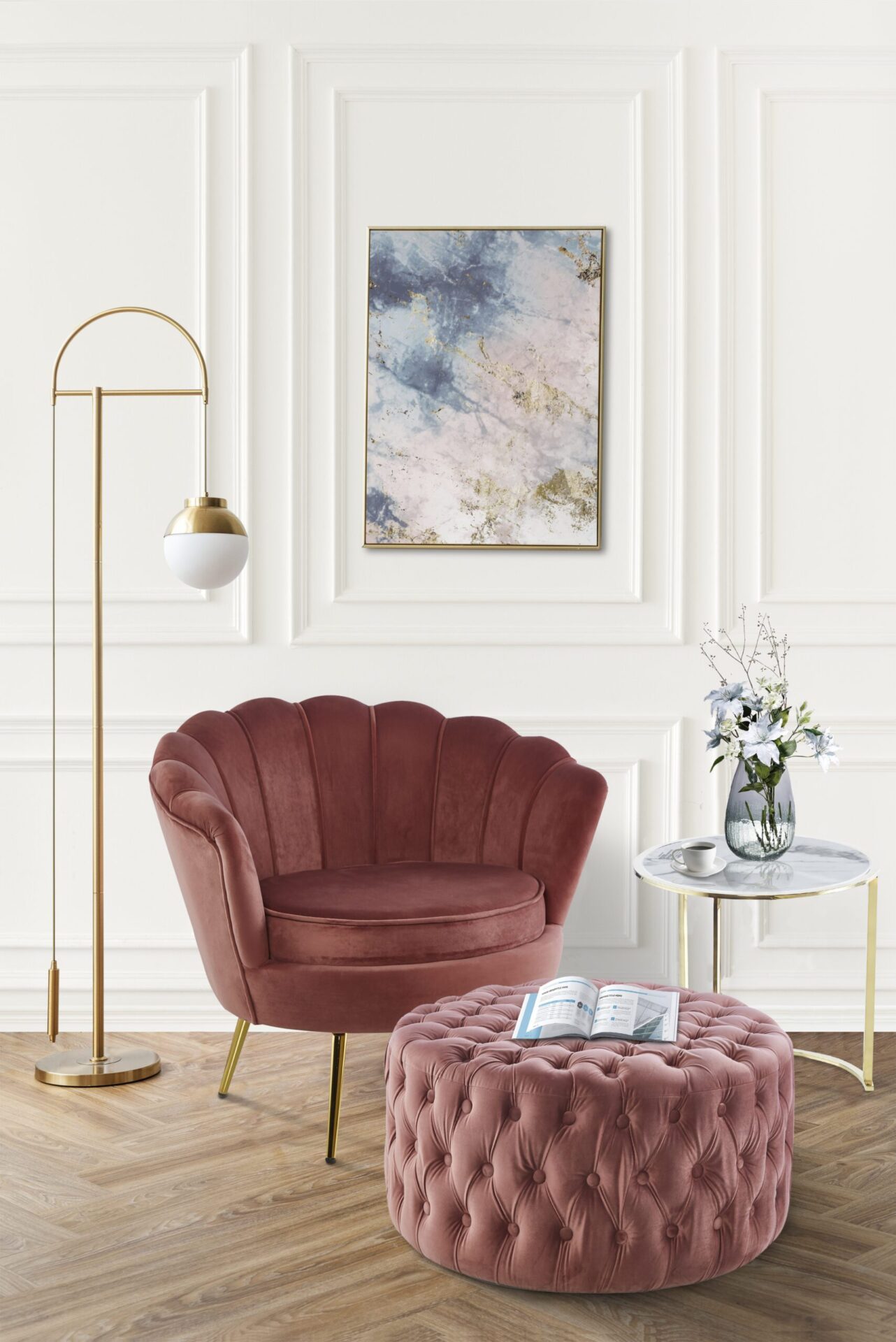 Picture frame with abstract art by a pink velvet armchair